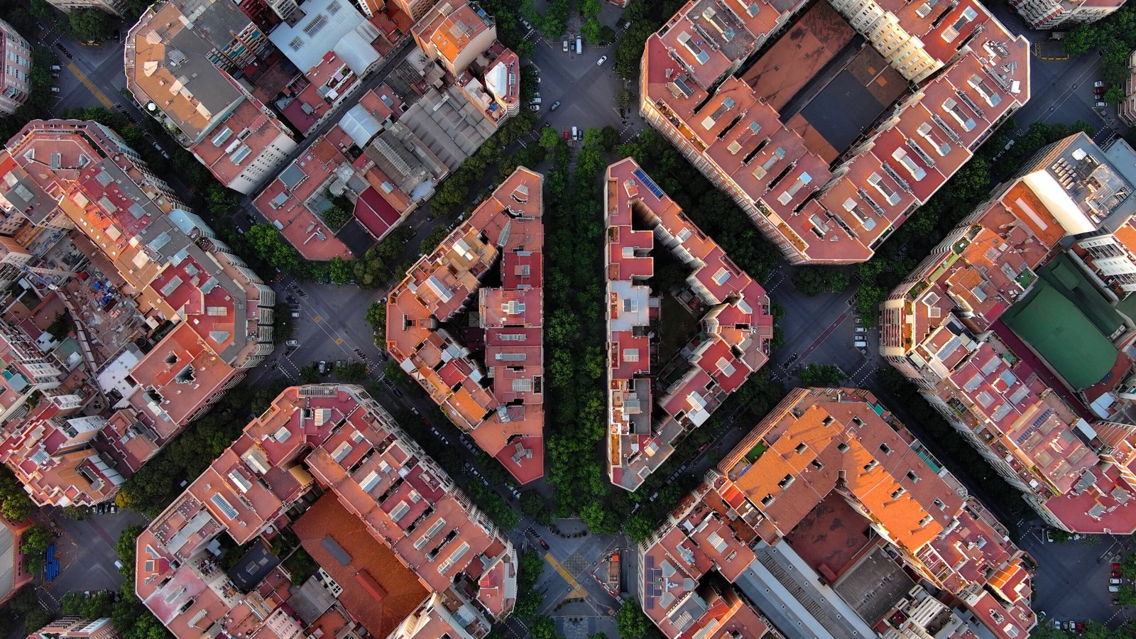 Aerial view of Barcelona’s Eixample district showing its iconic grid layout and octagonal blocks